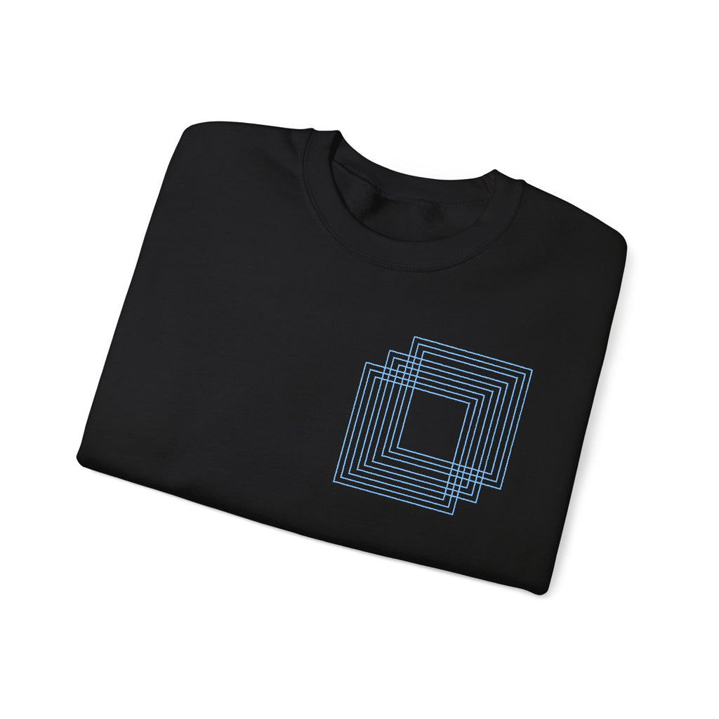 Black cotton t-shirt with blue geometric square design, folded neatly. Comfy Elegance.