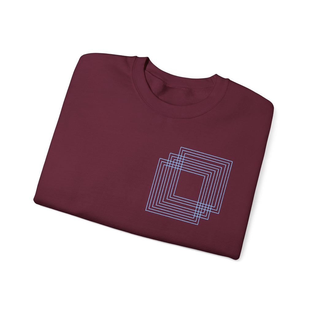 Folded maroon cotton sweatshirt with blue geometric square design, Comfy Elegance