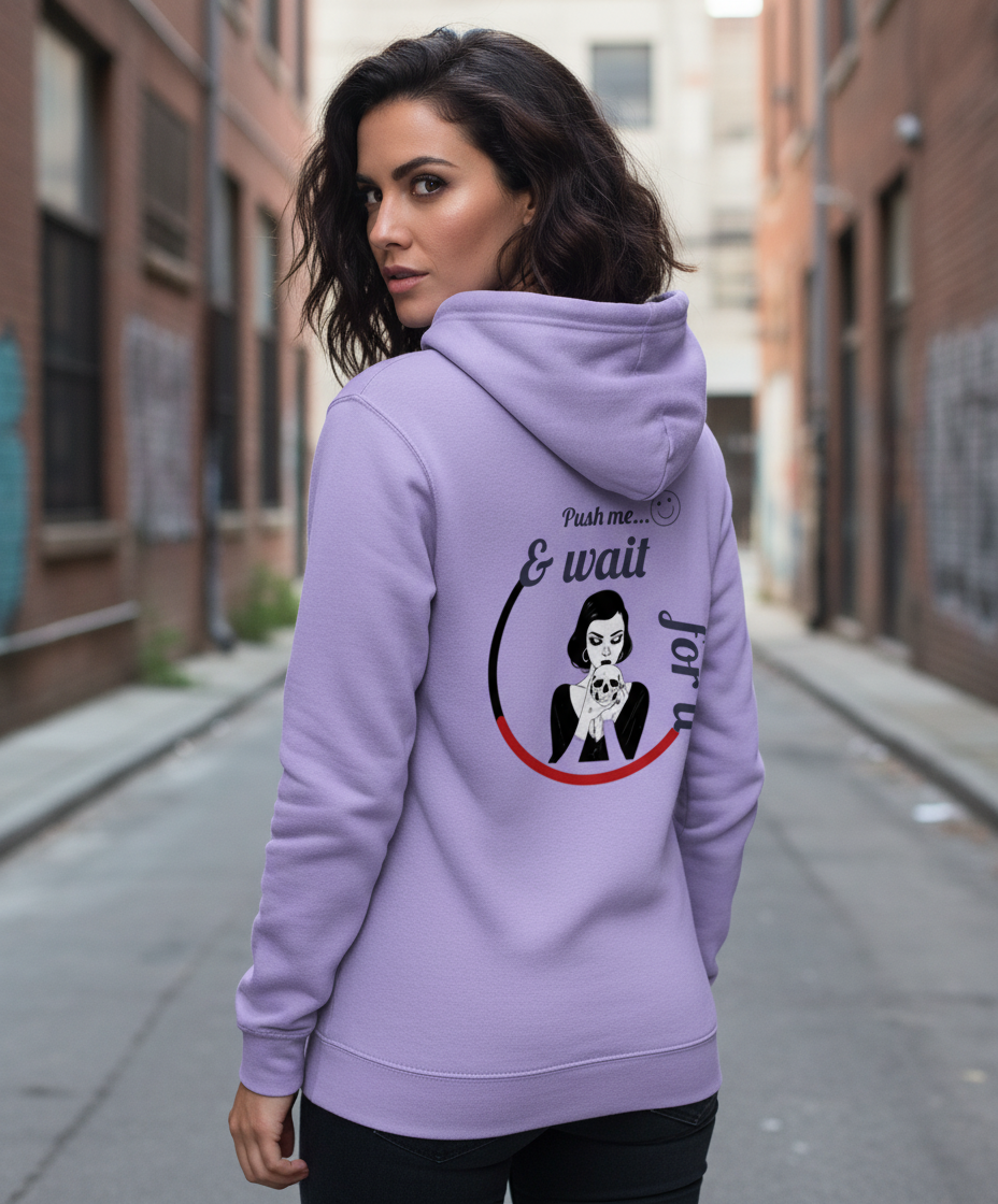 Woman wearing a light purple cotton hoodie with graphic print, stylish streetwear by Comfy Elegance.
