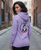 Woman wearing a light purple cotton hoodie with graphic print, stylish streetwear by Comfy Elegance.