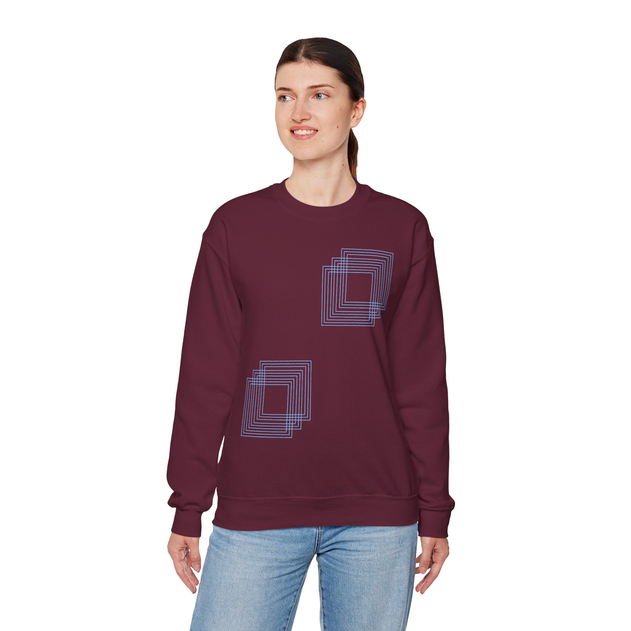 Woman wearing a burgundy cotton sweatshirt with geometric blue square design, Comfy Elegance