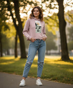Woman wearing a pink graphic hoodie and blue jeans outdoors, soft cotton fabric, Comfy Elegance