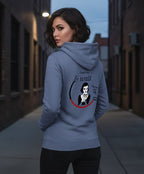 Woman wearing a blue graphic hoodie, soft fabric, in alleyway at dusk, Comfy Elegance